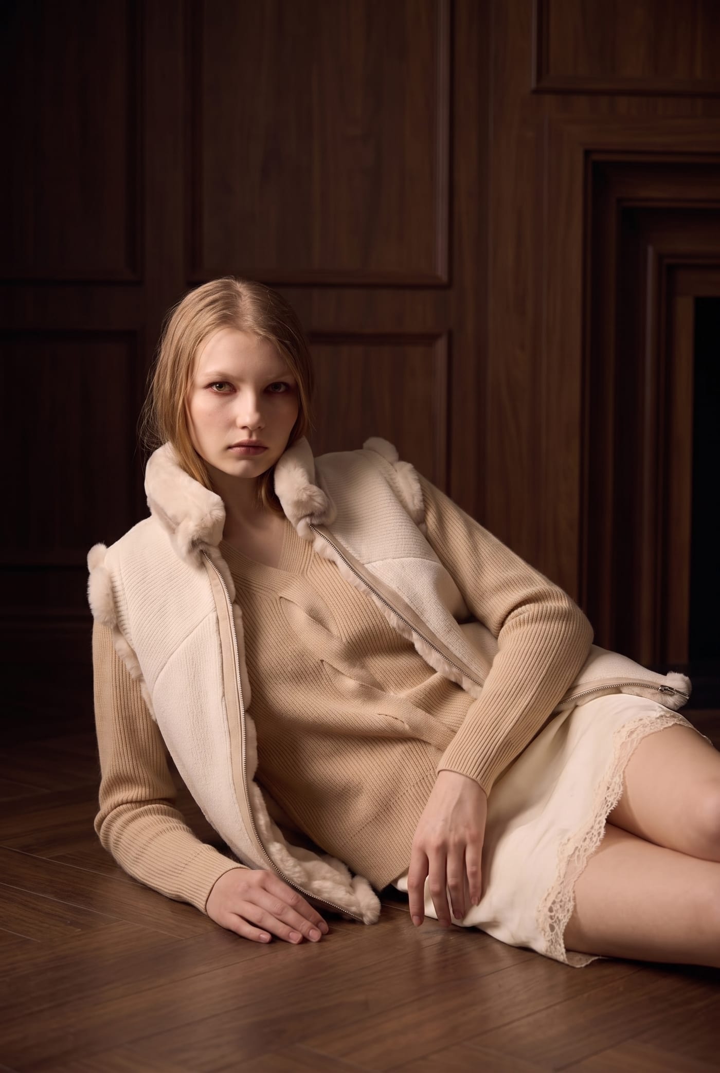 Ivory knit vest with fur trim over camel cashmere