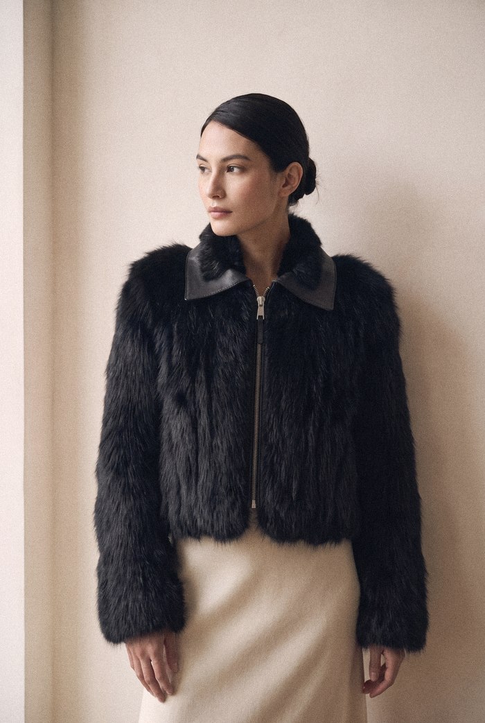 Fox and raccoon jacket with mink collar in black, worn