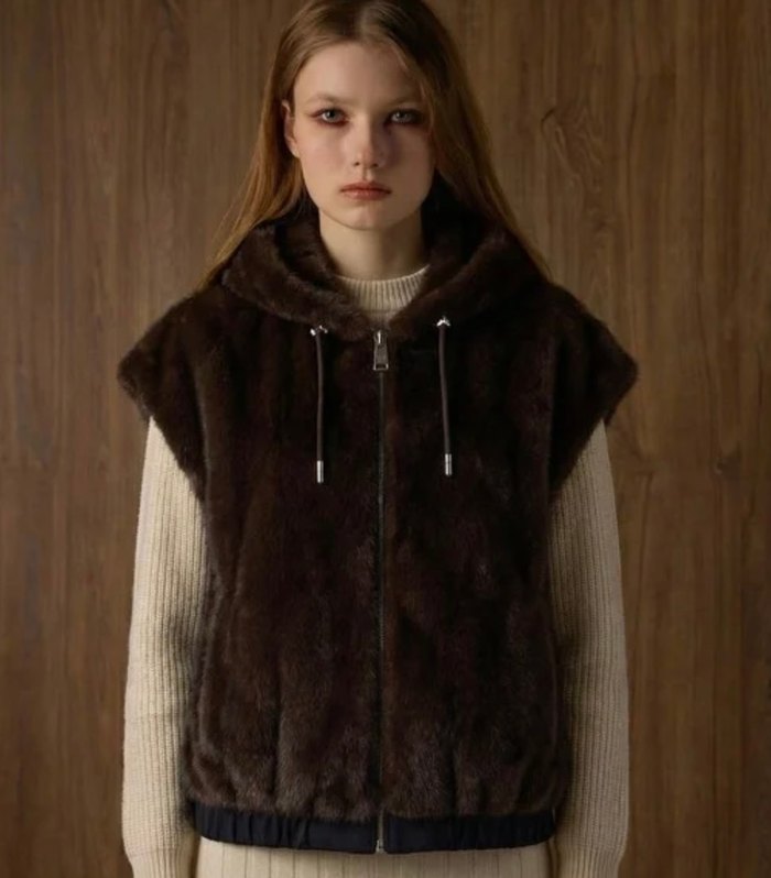 Reversible faux fur gilet in dark brown, worn