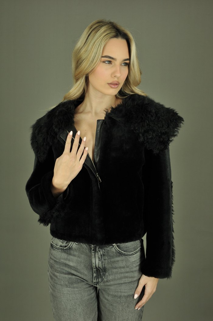 Angela shearling jacket in black, worn