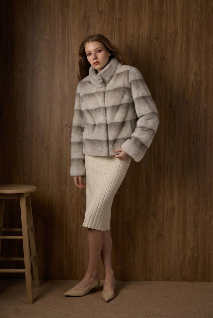 Faux mink panel jacket in grey, worn