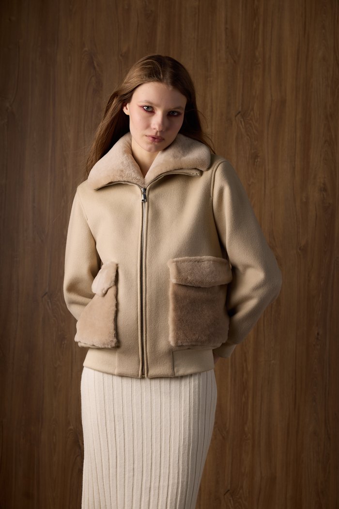 Kimi shearling bomber in beige, worn