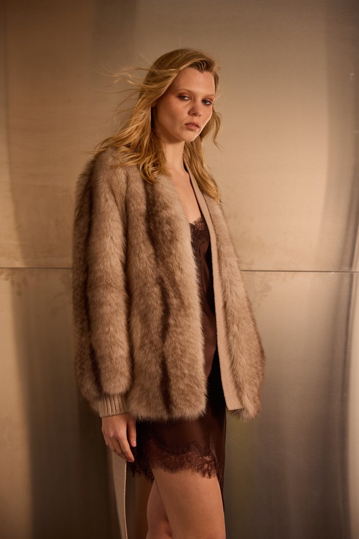 Belted cross-fox cardigan in camel, worn open