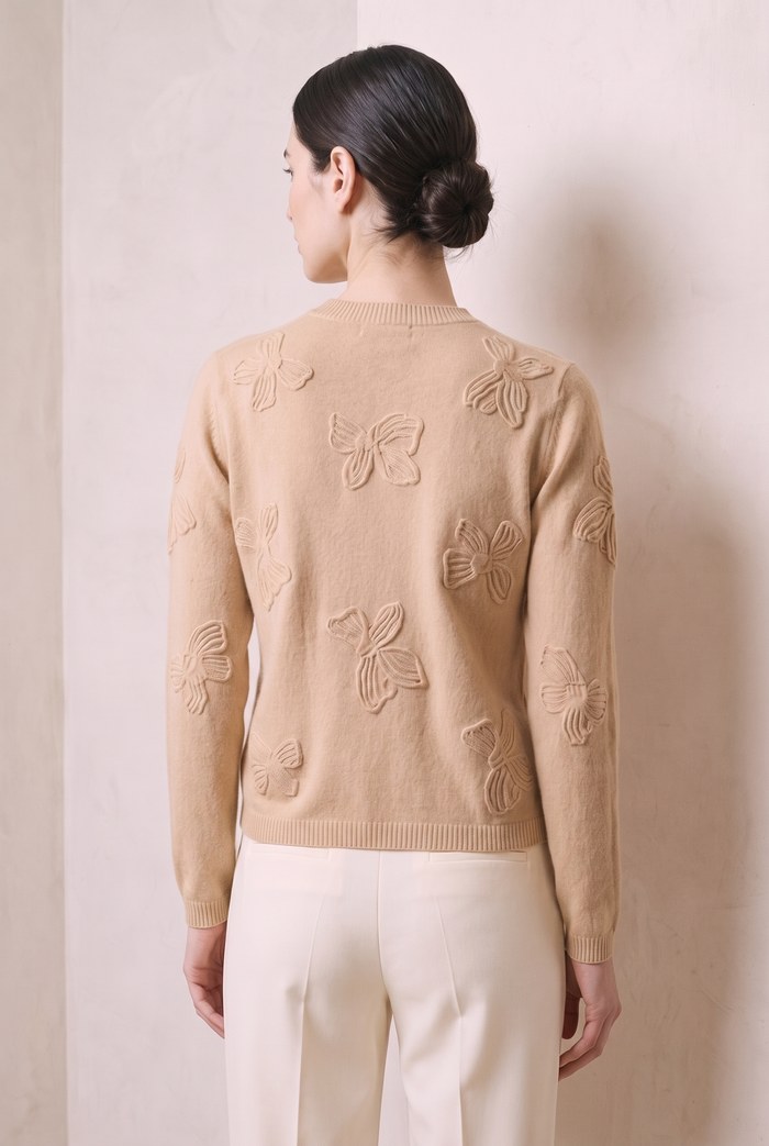 Style YRL568 oatmeal camel bow-motif sweater, back view