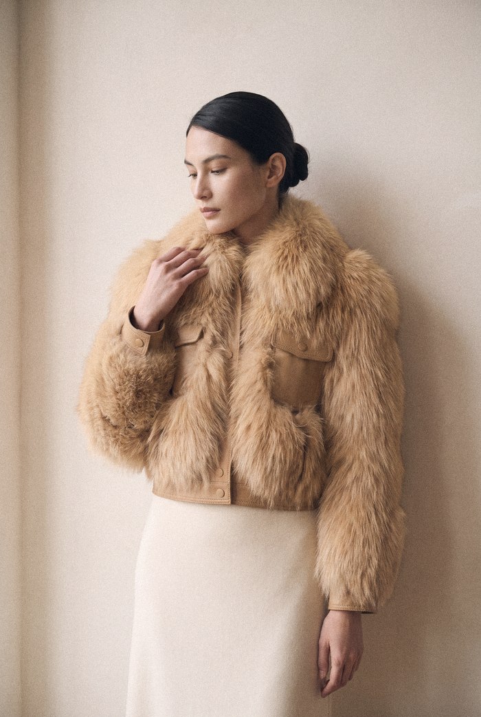 Fox jacket with leather pockets, worn
